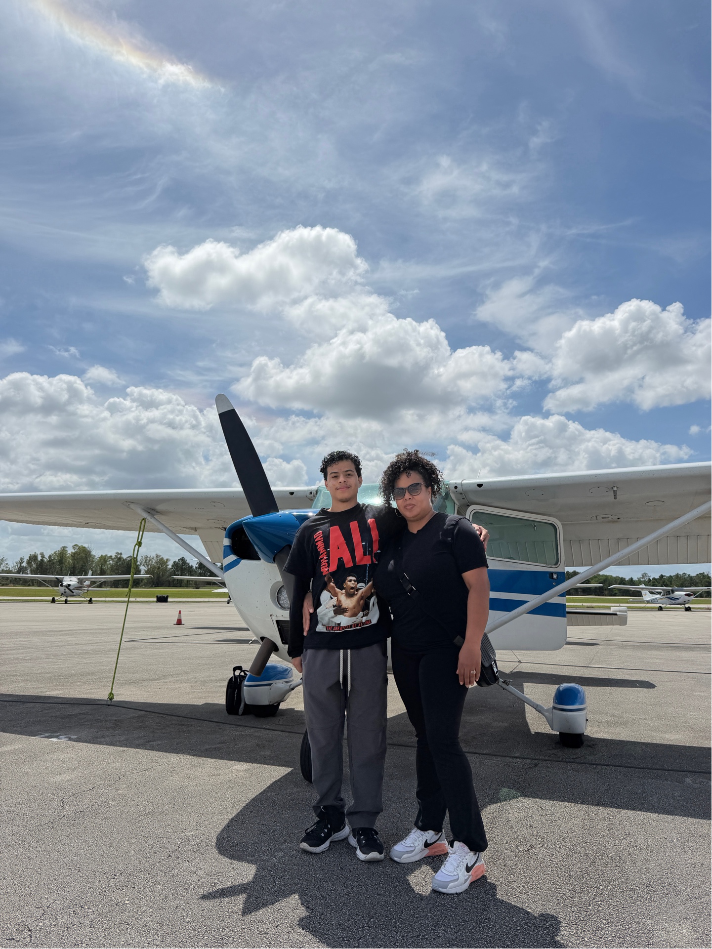 Mother and son in front of a Cessna 172 at KSFB